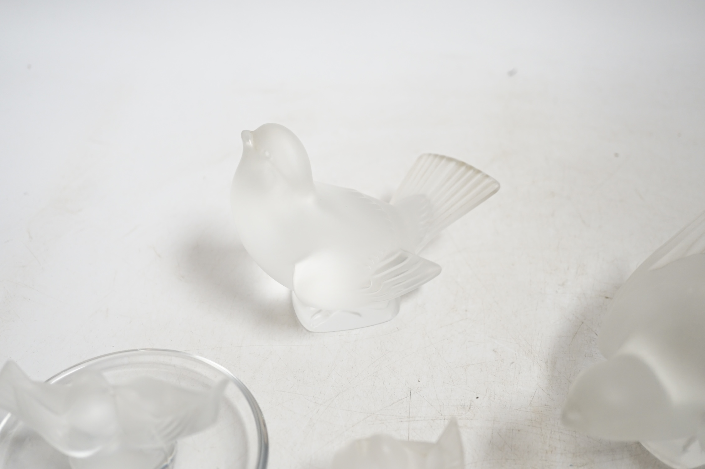 Three modern Lalique glass birds and a similar Lalique dish, each signed, largest 13.5cm wide. Condition - good